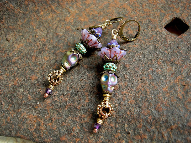 Mardi Gras Queen sugar skull earrings, with lilac & blue glass flowers, amethyst & iridescent hematite skull beads. 