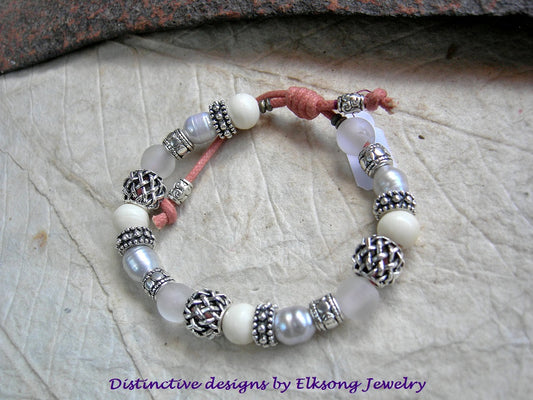 Adjustable white sliding knot bracelet with pearl, quartz, bone & silver beads. 