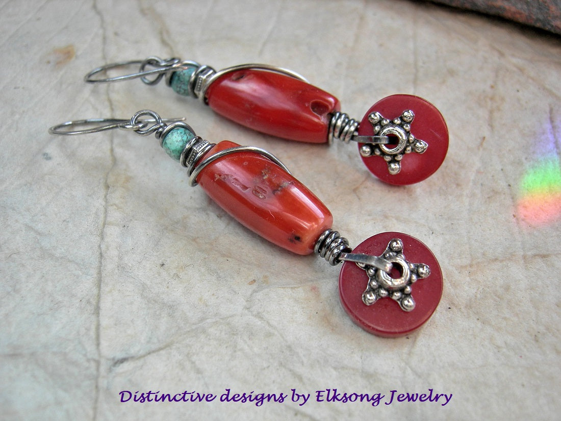 Red coral earrings with sterling wire wrap, faceted turquoise cube beads & silver finish Bali style star facers. 
