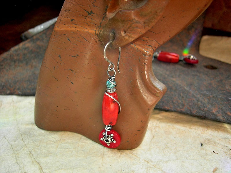 Red coral earrings with sterling wire wrap, faceted turquoise cube beads & silver finish Bali style star facers. 