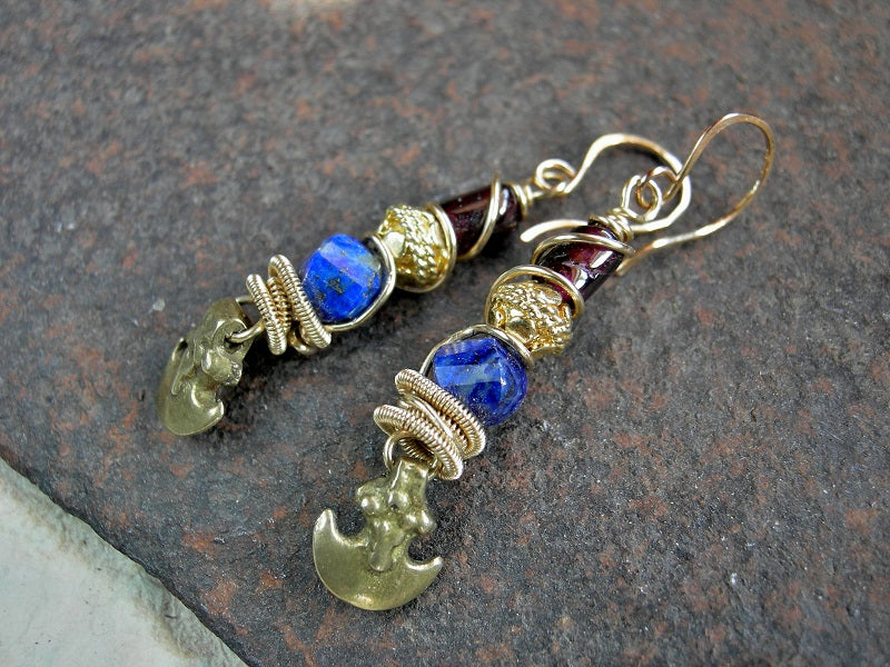 Natural color lapis & garnet earrings with 22kt gold-over-copper beads, golden brass wire wrap & vintage ethnic brass crescent charms. 