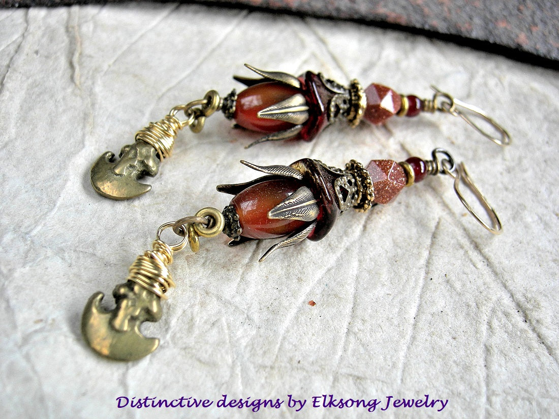 Golden Crescent earrings with carnelian, goldstone, glass flowers, antiqued brass caps & vintage ethnic brass crescent charms. 14kt gold filled ear wires. 