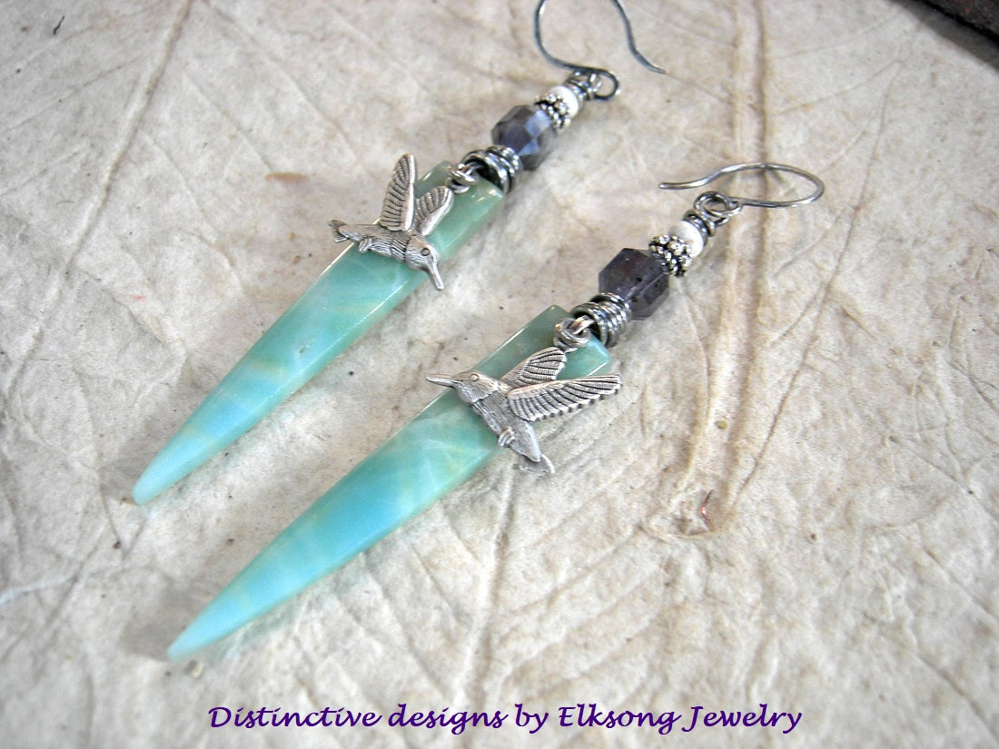 Spring Storm earrings with blue amazonite dagger tabs, silver hummingbird charms, faceted gray blue iolite, white magnesite & handmade sterling ear wires. 