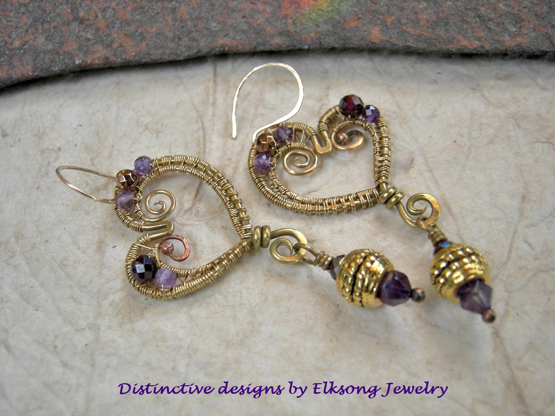 Heart O Gold wire wrap earrings with abstract heart shapes, faceted amethyst, garnet & golden hematite. 14kt gold fill ear wires. 