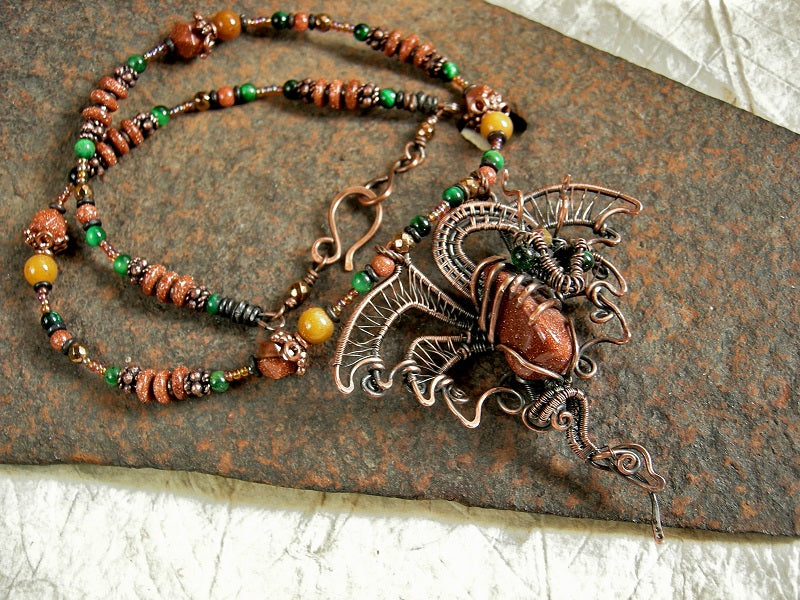 Art to wear copper wire wrap dragon strung bead necklace with goldstone, green tiger eye, golden jade, copper caps & beads. 