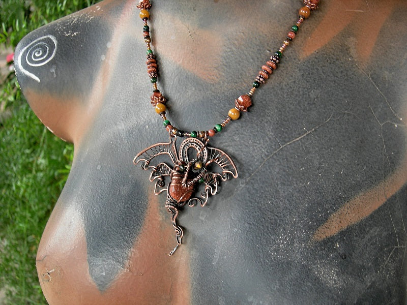 Dragons Hoard strung bead necklace with copper wire wrap dragon, goldstone, green tiger eye, golden jade, copper caps & beads. 