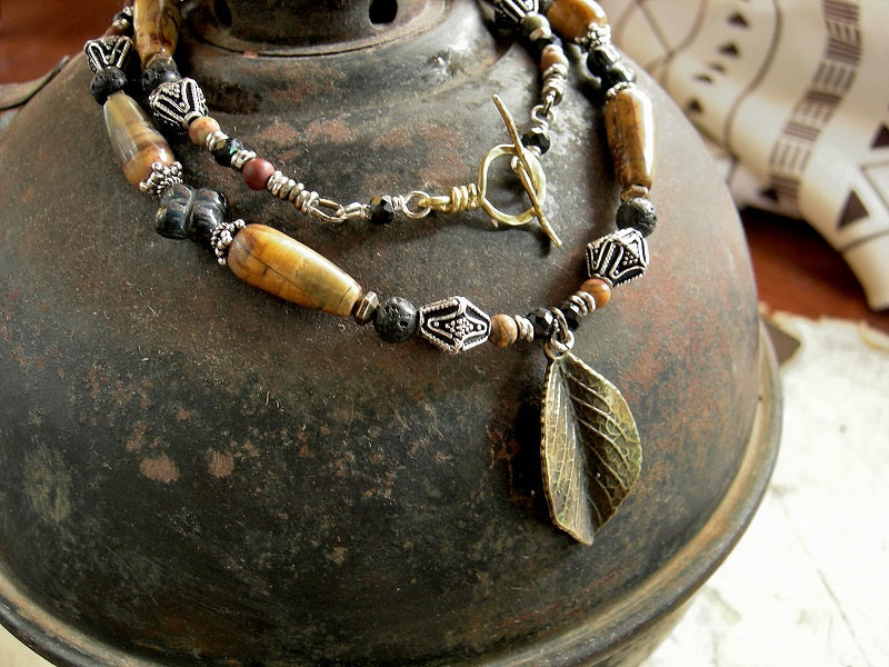 Forest theme necklace with earthy black & brown gemstone, sterling-over-copper beads & antiqued bronze leaf focal. 