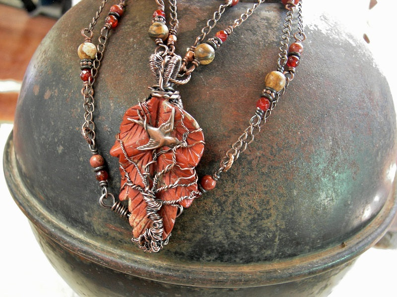 Boho luxe necklace with red jasper leaf & copper wire wrap tree & swallow focal, double copper chain, carnelian & jasper beads. 