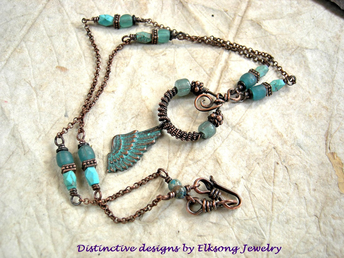 Little Wing necklace with copper chain, copper wire wrap focal with glass & copper beads, copper verdigris wing charm. Java glass & faceted turquoise beads. 