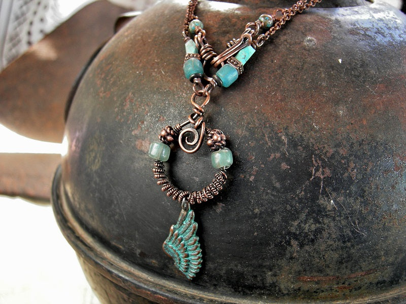 Earthy boho necklace with copper chain, copper wire wrap focal with glass & copper beads, copper verdigris wing charm. Java glass & faceted turquoise beads. 