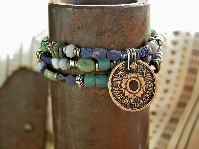 A triple wrap bracelet with Japanese coin focal, strung lapis, turquoise, chrysoprase, Owyhee blue opal, ceramic, aqua glass & sterling-over-copper beads.