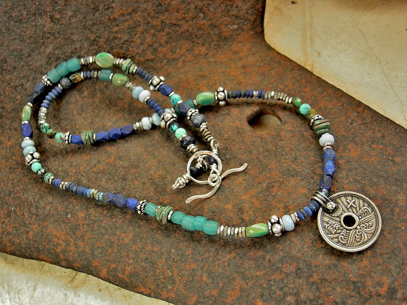 Japanese coin focal wrap bracelet with strung lapis, turquoise, chrysoprase, Owyhee blue opal, ceramic, aqua glass & sterling-over-copper beads. 