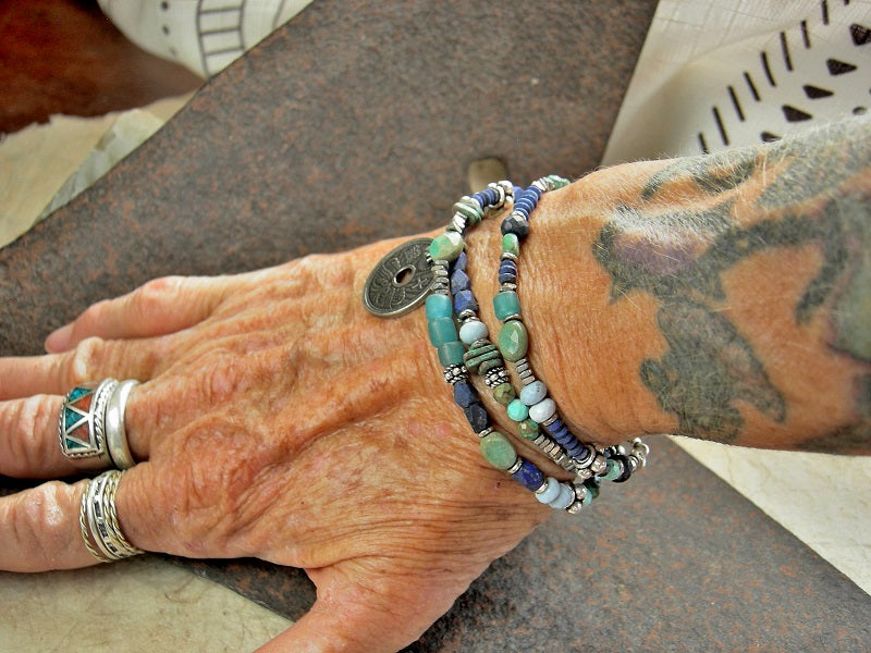 Boho luxe, blue & silver wrap bracelet with strung lapis, turquoise, chrysoprase, Owyhee blue opal, ceramic, aqua glass & sterling-over-copper beads. Japanese coil focal. 