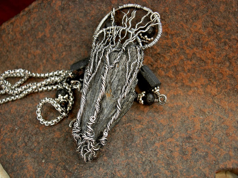Silver wire wrap tree statement necklace with triple trees on black kyanite fan. Black gemstone beads & stainless steel box chain. 