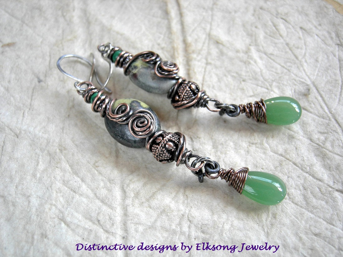 Rainforest earrings with serpentine ovals & oxidized copper wire wrap, malachite, copper beads & jade green glass tear drops. 