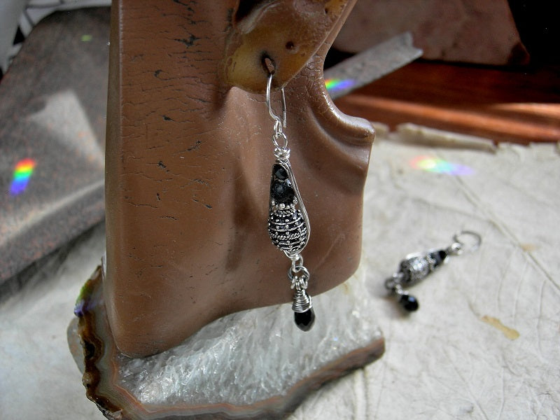 Sophisticated sterling & black earrings with sterling-over-copper Bali style beads & black gemstone in sterling pea pod wire wrap. Black crystal tear drops. 