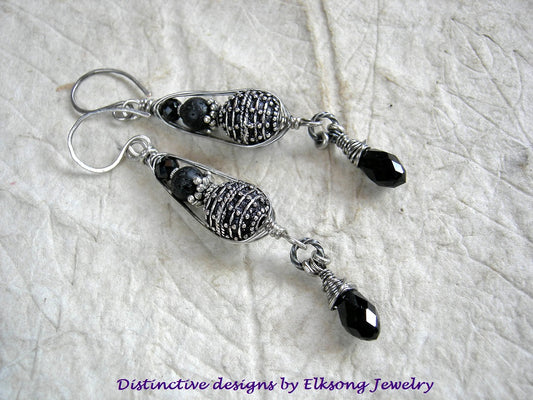 Sophisticated sterling & black earrings with sterling-over-copper Bali style beads & black gemstone in sterling pea pod wire wrap. Black crystal tear drops. 