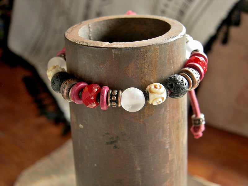 Boho adjustable sliding knot bracelet in bold black, white & red. Carved bone, stone, ceramic & glass beads on red cord. 