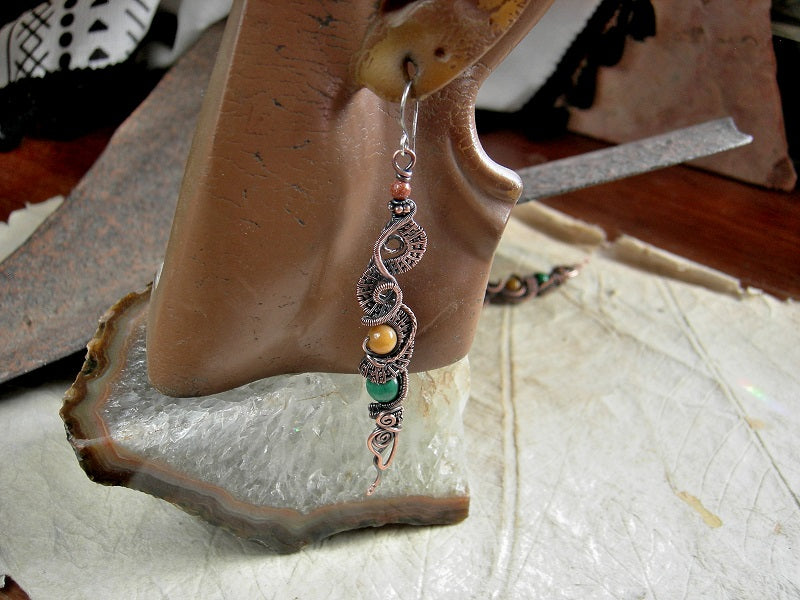 Dramatically long copper wire wrap earrings with malachite, golden jade & goldstone rounds. Handmade sterling ear wires. 