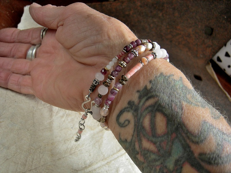Pink gemstone & mixed metal wrap bracelet/necklace with rose quartz, pink coral, mother-of-pearl, freshwater pearl, red tourmaline & thulite beads. Adjustable sterling hook & eye clasp. 