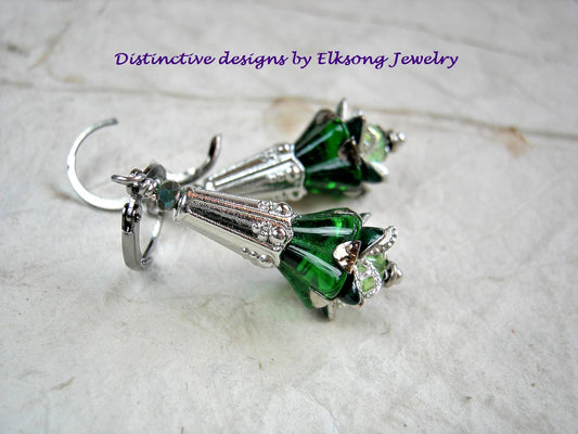 Flower drop earrings in Elven green & silver. Emerald green glass flowers, silver finish details & crystal. 