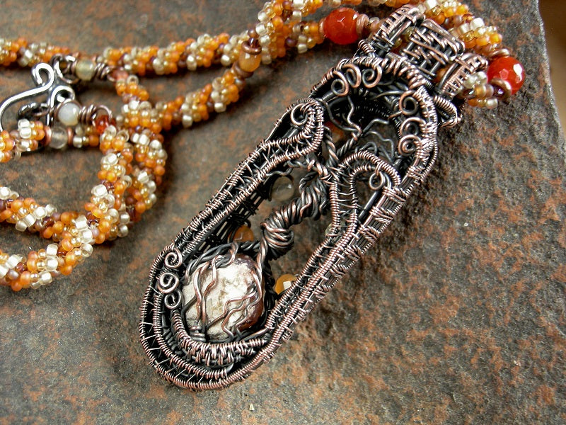 Copper tree statement necklace with wire wrapped tree & faceted carnelian focal, woven seed bead rope necklace. Shades of orange & copper. 