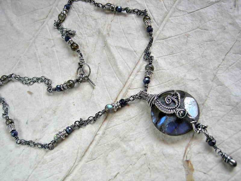 Boho luxe, sterling wire wrap necklace with luminous labradorite & faceted sapphire beads. Sterling toggle clasp. 