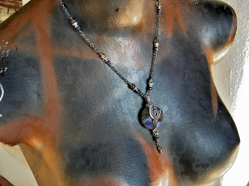 Sterling wire wrap necklace with smoky blue gemstone & oxidized silver. Dark & luminous, boho luxe style.