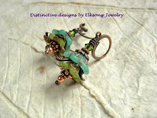Dainty Summer Grass earrings with green glass & resin flowers, copper caps & beads and Swarovski crystals. 