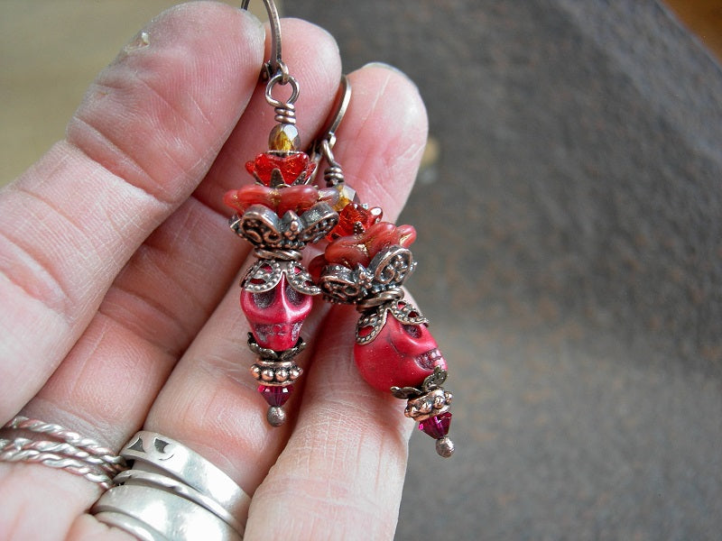 Boho chic red sugar skull earrings with orange glass flower & antiqued copper crowns. Bold & colorful Fire Spirit