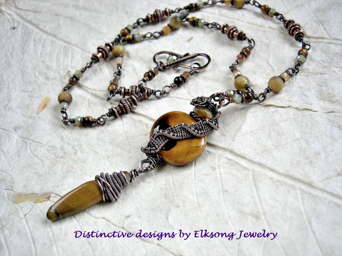 Rich autumn color necklace with gemstone, crystal & copper beads, oxidized copper wire wrap & ceramic bead focal. 