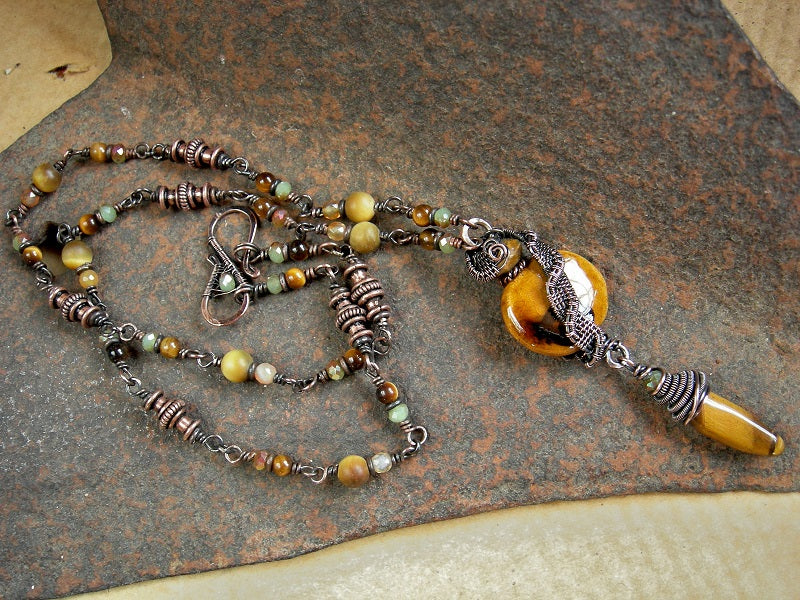 Boho luxe autumn color necklace with gemstone, crystal & copper beads, oxidized copper wire wrap & ceramic bead focal. 
