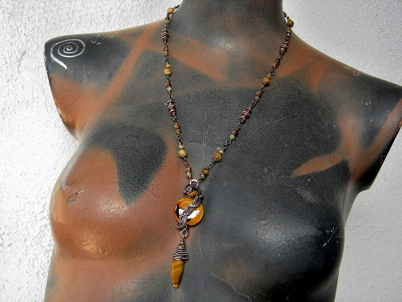 Rich autumn color necklace with gemstone, crystal & copper beads, oxidized copper wire wrap & ceramic bead focal. 