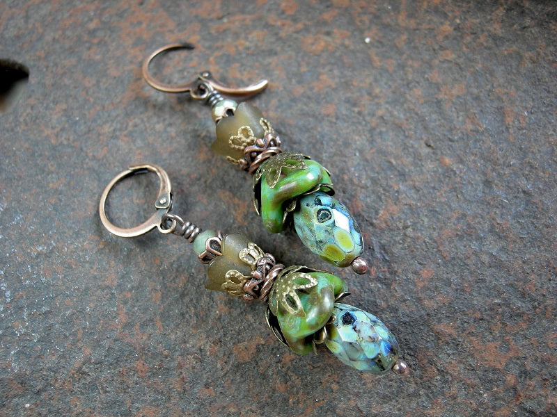 Green & brown flower earrings with glass & resin flowers, faceted glass beads & antiqued copper & brass details. 