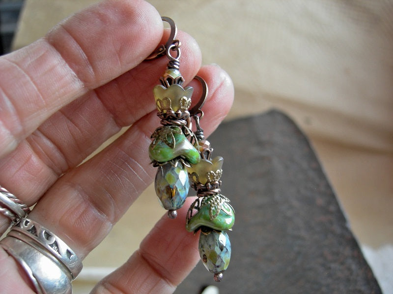 Boho chic flower earrings with green & brown glass & resin flowers, faceted glass beads & antiqued copper & brass details. 