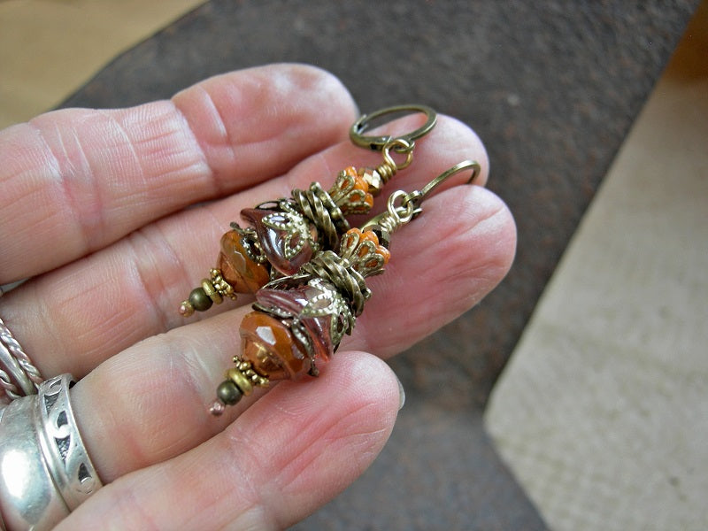 Persimmon faery drop earrings with glass flowers & faceted glass beads. Antiqued brass filigree & leverback earwires. 