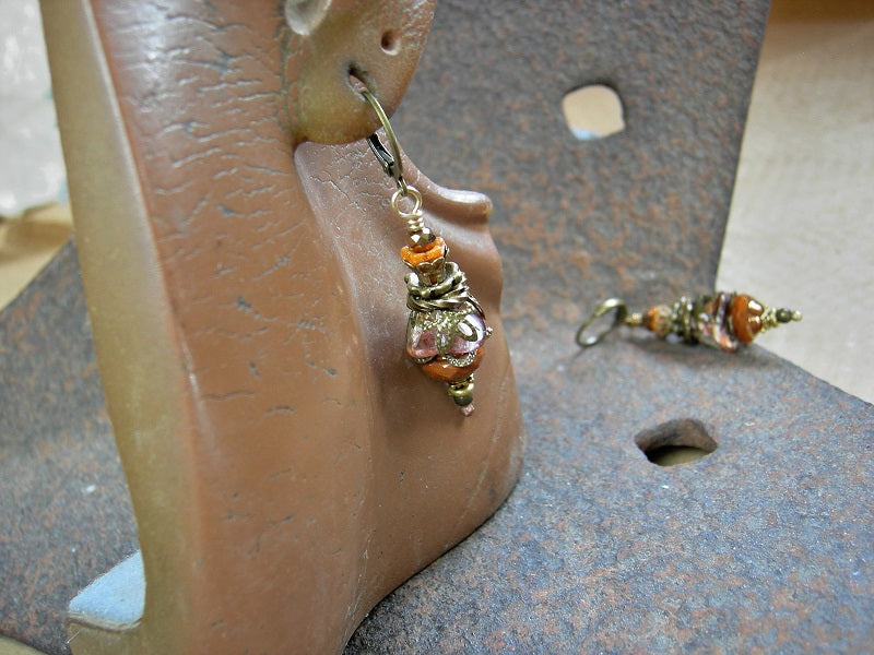 Persimmon drop earrings with glass flowers & faceted glass beads. Antiqued brass filigree & leverback earwires. 