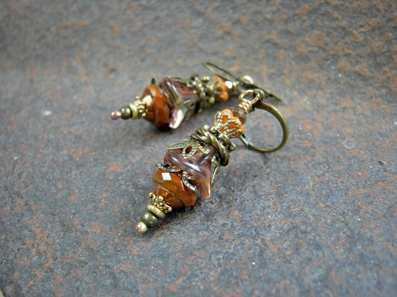 Orange flower drop earrings with glass flowers & faceted glass beads. Antiqued brass filigree & leverback earwires. 