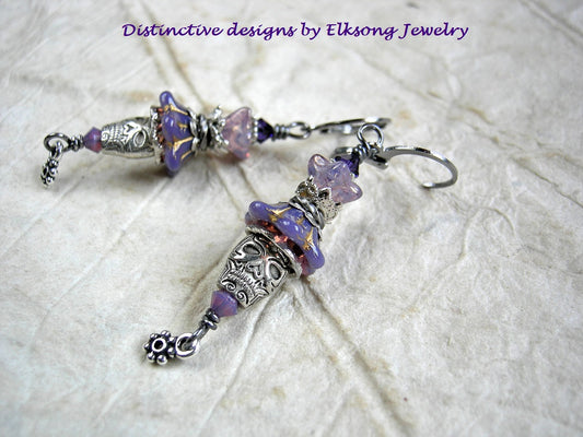 Lavender & silver sugar skull earrings with glass flowers, silver finish skull beads & flower drops and Swarovski crystal. 