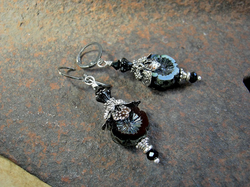 Black glass flower earrings, with silvery details & faceted crystal. 