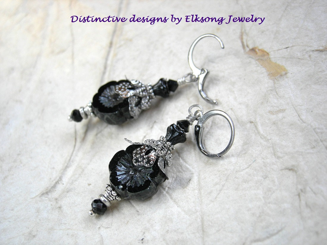 Night Bloom earrings with black glass flowers, silvery details & crystal. 