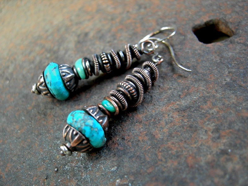 Earthy elegant earrings with turquoise, antiqued copper caps & beads and oxidized copper wire wrap. Sterling ear wires. 