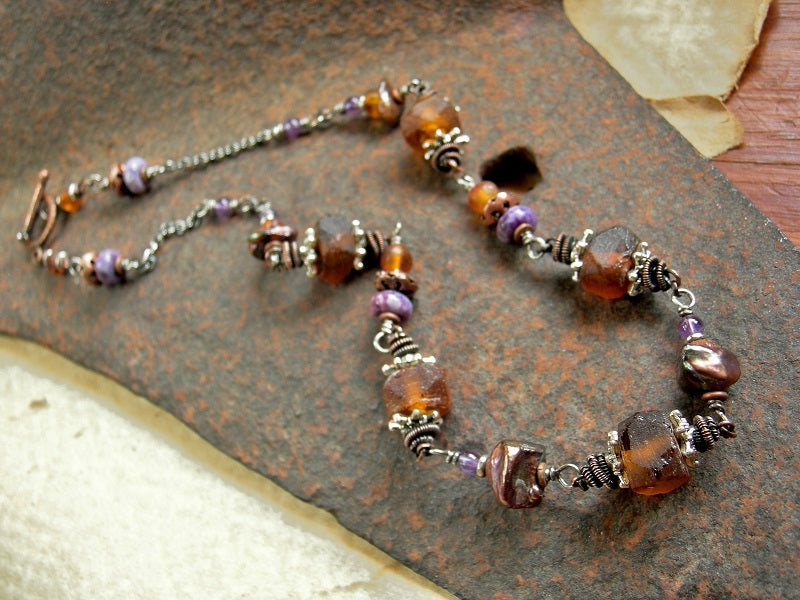 Wrapped link necklace with natural amber, purple gemstone, recycled glass & keshi pearls. Oxidized copper wire wrap links. 