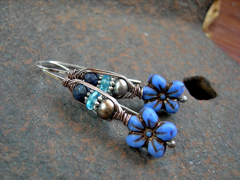 Cornflower blue earrings with glass flowers, freshwater pearls & faceted lapis. Wrapped ear hook style. 