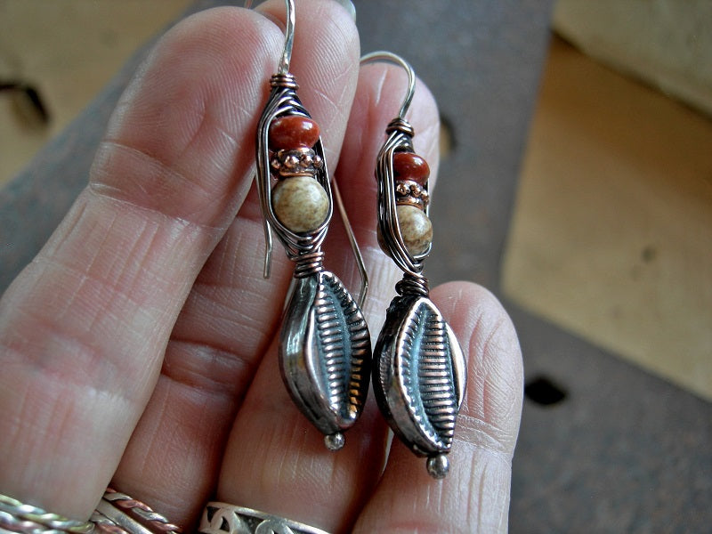 Boho urban wrapped hook style earrings, with hollow copper leaf beads, red & brown jasper. Sterling ear wires. 