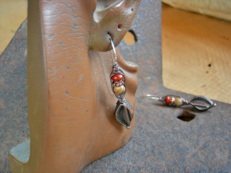Copper leaf wrapped hook style earrings, with hollow copper beads, red & brown jasper. Sterling ear wires. 