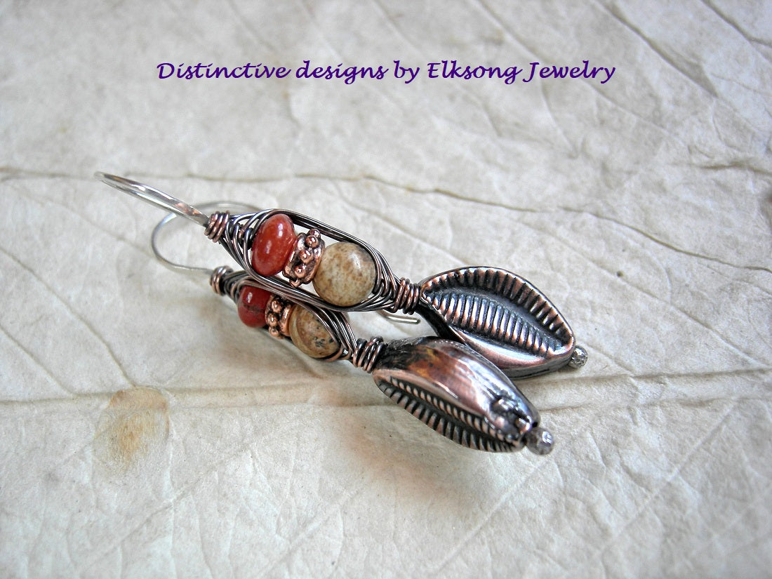 Copper leaf wrapped hook style earrings, with hollow copper beads, red & brown jasper. Sterling ear wires. 