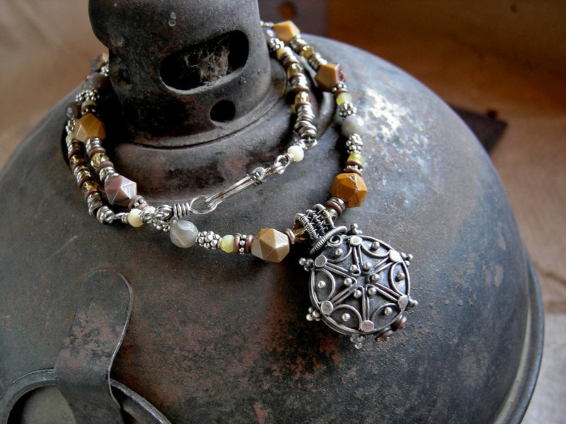 Earthy boho bead necklace with faceted yellow gemstone, silver Bali focal, silver & copper heishi & hook and eye clasp. 