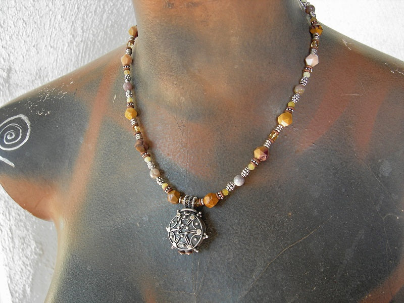 Boho luxe bead necklace with faceted yellow gemstone, silver Bali focal, silver & copper heishi & hook and eye clasp. 