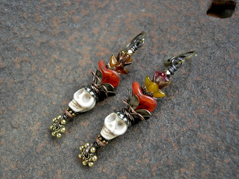 Sugar skull earrings with bone magnesite beads, orange & yellow glass flowers, brass & copper filigree. 